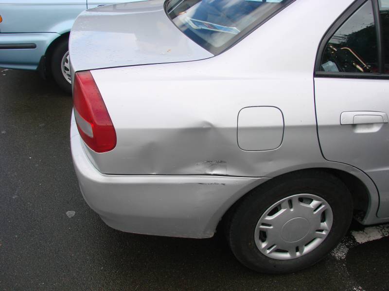 Dented car due to campervan accident in New Zealand