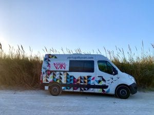 Portugal campervan trip - campervan parked in front of dunes